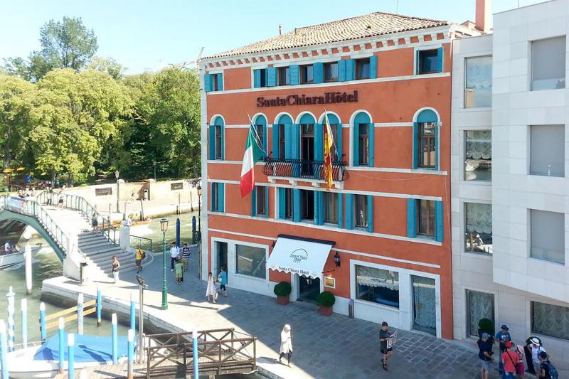 Hotel Santa Chiara historic exterior with step free entrance and canalside views