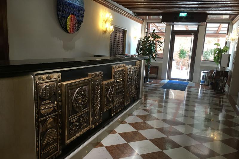 Standing height front desk with ornate detailing