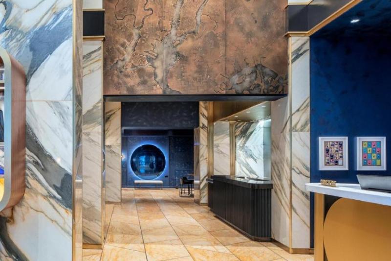 Lobby and front desk with marble decor