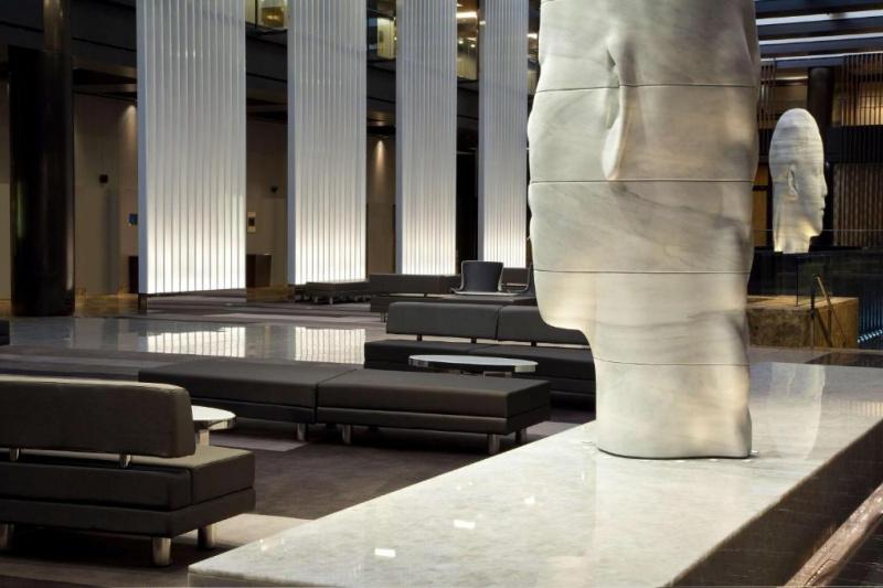 Large lobby with seating areas and giant statues