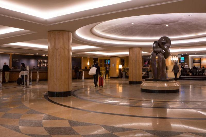 Spacious lobby with a seating area and standing counters
