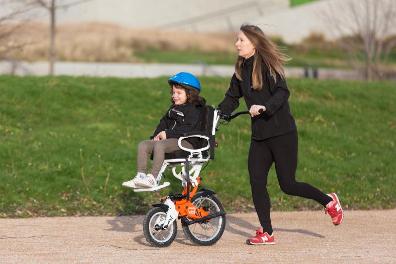 Enjoying an outdoor activity and family day with a joëlette kids wheelchair